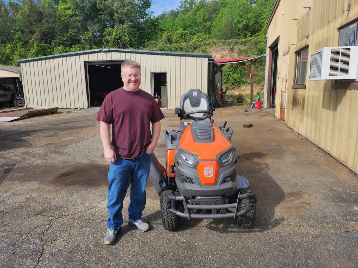 Customer with a new Husqvarna riding mower